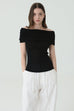 Noir off-shoulder knit in black